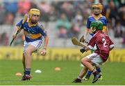 6 August 2017; Harry Codd of Rathnure NS, Enniscorthy, Co Wexford, representing Tipperary, in action against Faolán Ó Ceallaigh of Gaelscoil Eoghain Uí Thuairisc, Co Carlow, representing Galway, during the INTO Cumann na mBunscol GAA Respect Exhibition Go Games at Galway v Tipperary - GAA Hurling All-Ireland Senior Championship Semi-Final at Croke Park in Dublin. Photo by Piaras Ó Mídheach/Sportsfile