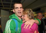 22 April 2012; Ireland's Adam Nolan, who won a gold medal at AIBA European Olympic Boxing Qualifying Championships and qualification for the London Games 2012, celebrates with his mother Anne, on his arrival in Dublin Airport following the qualifying Championships in Trabzon, Turkey. Dublin Airport, Dublin. Picture credit: David Maher / SPORTSFILE
