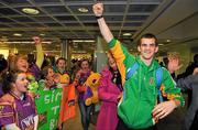 22 April 2012; Ireland's Adam Nolan, who won a gold medal at AIBA European Olympic Boxing Qualifying Championships and qualification for the London Games 2012, celebrates with family and friends on his arrival in Dublin Airport following the qualifying Championships in Trabzon, Turkey. Dublin Airport, Dublin. Picture credit: David Maher / SPORTSFILE