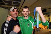 22 April 2012; Ireland's Adam Nolan, who won a gold medal at AIBA European Olympic Boxing Qualifying Championships and qualification for the London Games 2012, celebrates with his coach Pete Taylor, on his arrival in Dublin Airport following the qualifying Championships in Trabzon, Turkey. Dublin Airport, Dublin. Picture credit: David Maher / SPORTSFILE