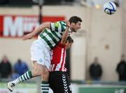 23 April 2012; Ken Oman, Shamrock Rovers, in action against Stephen McLaughlin, Derry City. Setanta Sports Cup Semi-Final, Second Leg, Derry City v Shamrock Rovers, Brandywell, Derry. Picture credit: Oliver McVeigh / SPORTSFILE