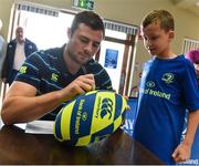 9 August 2017; Robbie Henshaw signs the rugby ball of Dylan Ledwith during the Bank of Ireland Leinster Rugby Summer Camp at Longford RFC in Lisbrack, Longford. Photo by David Maher/Sportsfile