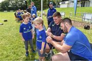 9 August 2017; Micheal Butler getting an autograph from Leinster's Tadhg Furlong and Sean O'Brien during the Bank of Ireland Leinster Rugby Summer Camp at De La Salle RFC in Glenamuck North, Dublin. Photo by Matt Browne/Sportsfile