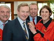 25 April 2012; An Taoiseach Enda Kenny T.D. with Special Olympics Athlete Elizabeth Mair, from Rathfarnham, Dublin, and a member of the Blackrock Flyers Club, when cross party members including Independent T.D. Finian McGrath, Timmy Dooley, T.D., met at Government Buildings ahead of Special Olympics Ireland’s Annual Collection Day on Friday April 27th. This is the biggest annual fundraising event in aid of Special Olympics Ireland and will see more than 4,000 volunteers take to the streets in over 200 locations throughout Ireland on the day. Government Buildings, Upper Merrion Street, Dublin. Picture credit: Ray McManus / SPORTSFILE