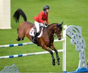 10 August 2017; Laura Kraut of USA competing on Curious George during the Anglesea Serpentine Stakes at Dublin Horse Show at the RDS in Ballsbridge, Dublin. Photo by Cody Glenn/Sportsfile