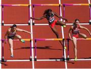 11 August 2017; Athletes, from left, Nadine Hildebrand of Germany, Deborah John of Trinidad & Tobago and Elvira Herman of Belarus compete in their heat of the Women's 100m Hurdles event during day eight of the 16th IAAF World Athletics Championships at the London Stadium in London, England. Photo by Stephen McCarthy/Sportsfile