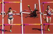 11 August 2017; Athletes, from left, Nadine Hildebrand of Germany, Deborah John of Trinidad & Tobago and Elvira Herman of Belarus compete in their heat of the Women's 100m Hurdles event during day eight of the 16th IAAF World Athletics Championships at the London Stadium in London, England. Photo by Stephen McCarthy/Sportsfile