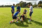 9 August 2017; Leinster academy players Vakh Abdaladze and Jimmy O'Brien coaching players during the Bank of Ireland Leinster Rugby School of Excellence event at Kings Hospital in Palmerstown, Dublin. Photo by Matt Browne/Sportsfile