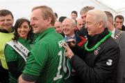 28 April 2012; An Taoiseach Enda Kenny T.D. has his jersey signed by Republic of Ireland manager Giovanni Trapattoni ahead of the Enda's Trek with Trap's Green Army Charity Climb. Croagh Patrick, Murrisk, Carrowmacloughlin, Co. Mayo. Picture credit: Matt Browne / SPORTSFILE