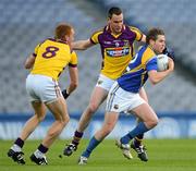 28 April 2012; Niall Mulligan, Longford, in action against Daithí Waters, 9, and Andrew Shore, Wexford. Allianz Football League, Division 3 Final, Longford v Wexford, Croke Park, Dublin. Picture credit: Ray McManus / SPORTSFILE