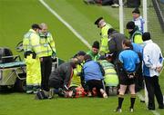 29 April 2012; The Tyrone corner back Aidan McCrory is attended to by first aid personnel and both Tyrone and Kildare medical staff. Allianz Football League, Division 2 Final, Tyrone v Kildare, Croke Park, Dublin. Picture credit: Ray McManus / SPORTSFILE