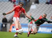 29 April 2012; Aidan Walsh, Cork, scores his side's second goal as Keith Higgins, Mayo, attempts to block. Allianz Football League, Division 1 Final, Cork v Mayo, Croke Park, Dublin. Picture credit: Oliver McVeigh / SPORTSFILE