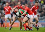 29 April 2012; Barry Moran, Mayo, is tackled by Paudie Kissane, left, and Noel O'Leary, Cork. Allianz Football League, Division 1 Final, Cork v Mayo, Croke Park, Dublin. Picture credit: Ray McManus / SPORTSFILE