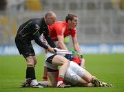 29 April 2012; Patrick Kelly, Cork, along with linesman Cormac Reilly, attempts to break up Graham Canty, Cork and Donal Vaughan, Mayo. Allianz Football League, Division 1 Final, Cork v Mayo, Croke Park, Dublin. Picture credit: Oliver McVeigh / SPORTSFILE