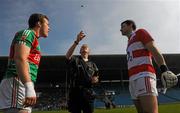 25 March 2012; Referee Joe McQuillan tosses the coin between captains Andy Moran, Mayo, left, and Alan Quirke, Cork, right. Allianz Football League Division 1, Round 6, Mayo v Cork, McHale Park, Castlebar, Co. Mayo. Picture credit: Pat Murphy / SPORTSFILE