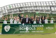 3 May 2012; Republic of Ireland stars Stephen Ward and Ciara Grant today launched the FAI eFlow Summer Soccer Schools programme for 2012. Due to the camps' increasing popularity, interested participants are encouraged to book early to avoid disappointment. Further information can be found at www.summersoccerschools.ie or by calling 1890653653. At the launch are Simon McBeth, Director of Communications & Customer Relations at eFlow, Republic of Ireland's Stephen Ward and Ciara Grant, with stars of the future, from left, Chris Dolan, from Donegal, Connor Davis, from Meath, Aideen McNamara, from Cork, Tara Berigan, from Meath, Liam Donlon, from Kildare, Ceola Donlon, from Kildare, Rachel Quinlivan, form Galway, Sean McNamara, from Cork, Joshua Quinlivan, from Galway, Christopher Carew, from Laois, and Shannon Cunningham, from Donegal. Aviva Stadium, Lansdowne Road, Dublin. Picture credit: Brian Lawless / SPORTSFILE