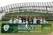 3 May 2012; Republic of Ireland stars Stephen Ward and Ciara Grant today launched the FAI eFlow Summer Soccer Schools programme for 2012. Due to the camps' increasing popularity, interested participants are encouraged to book early to avoid disappointment. Further information can be found at www.summersoccerschools.ie or by calling 1890653653. At the launch are Simon McBeth, Director of Communications & Customer Relations at eFlow, Republic of Ireland's Stephen Ward and Ciara Grant, with stars of the future, from left, Chris Dolan, from Donegal, Connor Davis, from Meath, Tara Berigan, from Meath, Aideen McNamara, from Cork, Liam Donlon, from Kildare, Ceola Donlon, from Kildare, Rachel Quinlivan, form Galway, Sean McNamara, from Cork, Joshua Quinlivan, from Galway, Christopher Carew, from Laois, and Shannon Cunningham, from Donegal. Aviva Stadium, Lansdowne Road, Dublin. Picture credit: Brian Lawless / SPORTSFILE
