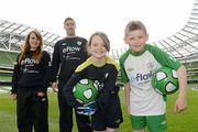3 May 2012; Republic of Ireland stars Stephen Ward and Ciara Grant today launched the FAI eFlow Summer Soccer Schools programme for 2012. Due to the camps' increasing popularity, interested participants are encouraged to book early to avoid disappointment. Further information can be found at www.summersoccerschools.ie or by calling 1890653653. At the launch is Republic of Ireland stars Stephen Ward and Ciara Grant with Rachel Quinlivan, from Galway, second from right, and Chris Dolan, from Donegal, right. Aviva Stadium, Lansdowne Road, Dublin. Picture credit: Brian Lawless / SPORTSFILE