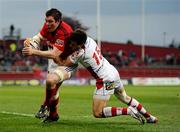 5 May 2012; Peter O'Mahony, Munster, on his way to scoring his side's second try despite the tackle of Adam D'Arcy, Ulster. Celtic League, Munster v Ulster, Thomond Park, Limerick. Picture credit: Stephen McCarthy / SPORTSFILE