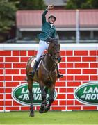 12 August 2017; Co-winner Daniel Coyle of Ireland celebrates clearing Land Rover Puisance on Cavalier Rusticana during the Dublin International Horse Show at RDS, Ballsbridge in Dublin. Photo by Cody Glenn/Sportsfile