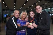 13 August 2017; Ireland team member Michaela Walsh, from Belfast who won Gold, with her mother Martine and dad Damien and brother Aiden after her return home with team Ireland from the European Union Elite Women’s Boxing Championships at Dublin Airport. Photo by Matt Browne/Sportsfile