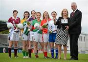 9 May 2012; All three Bord Gáis Energy Ladies NFL Finals will be held in Parnell Park on Saturday, 12th May, and all three finals will be broadcast live on TG4. At 1.15pm, in the Division 3 final Leitrim take on Westmeath. In the Division 2 final at 3.00pm Mayo take on Galway, while at 4.45pm in the Division 1 final Cork take on Monaghan. At a photocall ahead of the finals are Ger Cunningham, Sports Ambassador, Bord Gáis Energy, and Helen O'Rourke, CEO of the Ladies Gaelic Football Association, with players, from left, Laura Walsh, Westmeath, Mairead Stenson, Leitrim, Claire Hehir, Galway, Leona Ryder, Mayo, Elaine Harte, Cork, and Sharon Courtney, Monaghan. Parnell Park, Donnycarney, Dublin. Picture credit: Brian Lawless / SPORTSFILE