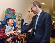 15 August 2017; Republic of Ireland manager Martin O'Neill shakes hands with Evan Desmond, age 9, from Dublin, during a visit to the LauraLynn Children's Hospice at Leopardstown Road in Dublin. Photo by David Maher/Sportsfile