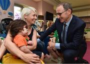 15 August 2017; Republic of Ireland manager Martin O'Neill with Oisin Campbell, age 2, from Letterkenny, Co Donegal, with his mother Fionnuala Nidhochartaigh during a visit to the LauraLynn Children's Hospice at Leopardstown Road in Dublin. Photo by David Maher/Sportsfile