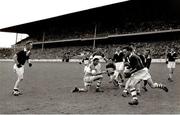 1960; Ollie Ryan, Louth, gets ready to pass the ball to Stephen White. Leinster Senior Football Championship Final, Offaly v Louth, Croke Park, Dublin. Picture credit: Connolly Collection / SPORTSFILE