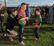 11 May 2012; Mark Gibbons, aged 11, from Clooonlaura, Co. Mayo, gets his jersey signed by Michael Conroy during a Mayo GAA Open Day 2012. Elverys MacHale Park, Castlebar, Co Mayo. Picture credit: Barry Cregg / SPORTSFILE