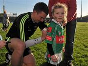 11 May 2012; Sorcha Munnelly, aged 5, from Castlebar, Co. Mayo, gets her jersey signed by Barry Moran during a Mayo GAA Open Day 2012. Elverys MacHale Park, Castlebar, Co Mayo. Picture credit: Barry Cregg / SPORTSFILE