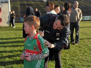 11 May 2012; Cillian Fadden, aged 7, from Ballyheame, Co. Mayo, gets his jersey signed by Peader Gardiner, during a Mayo GAA Open Day 2012. Elverys MacHale Park, Castlebar, Co Mayo. Picture credit: Barry Cregg / SPORTSFILE