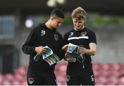 18 August 2017; Shane Griffin of Cork City, left, studies the match day programme with team-mate Kieran Sadlier ahead of the SSE Airtricity League Premier Division match between Cork City and Sligo Rovers at Turners Cross in Cork. Photo by Eóin Noonan/Sportsfile