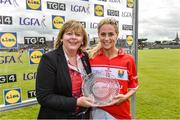 19 August 2017; Orla Finn of Cork is presented with her player of the match award by LGFA President Marie Hickey after the TG4 Ladies Football All-Ireland Senior Championship Quarter-Final match between Cork and Galway at Cusack Park in Westmeath. Photo by Matt Browne/Sportsfile