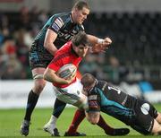 11 May 2012; Dave O'Callaghan, Munster, is tackled by Paul James and Ian Evans, Ospreys. Celtic League Play-Off, Ospreys v Munster, Liberty Stadium, Swansea, Wales. Picture credit: Steve Pope / SPORTSFILE