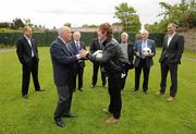 17 May 2012; RTÉ’s pundit Liam Brady and RTÉ’s radio presenter Hector O'hEochagain discuss tatics as fellow presenters and pundits, including Kenny Cunningham, John Giles, Eamon Dunphy, Bill O'Herlihy and Richard Sadlier watch on at the launch of RTÉ’s EURO 2012 coverage. RTÉ, Donnybrook, Dublin. Picture credit: Stephen McCarthy / SPORTSFILE