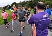 20 August 2017; Parkrun Ireland, in partnership with Vhi, expanded their range of junior events to ten with the introduction of the Oranmore Junior Parkrun on Sunday morning. Junior parkruns are 2km long and cater for 4 to 14 year olds, free of charge providing a fun and safe environment for children to enjoy exercise. To register for a parkrun near you visit www.parkrun.ie. New registrants should select their chosen event as their home location. You will then receive a personal barcode which acts as your free entry to any parkrun event worldwide. Pictured at the Oranmore Junior Parkrun, in partnnership with Vhi is William Furey from Vhi encouraging participants during the run. Rinville Park, Oranmore, Co Galway. Photo by Diarmuid Greene/Sportsfile