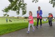 20 August 2017; Parkrun Ireland, in partnership with Vhi, expanded their range of junior events to ten with the introduction of the Oranmore Junior Parkrun on Sunday morning. Junior parkruns are 2km long and cater for 4 to 14 year olds, free of charge providing a fun and safe environment for children to enjoy exercise. To register for a parkrun near you visit www.parkrun.ie. New registrants should select their chosen event as their home location. You will then receive a personal barcode which acts as your free entry to any parkrun event worldwide. Pictured are participants Roisin Frawley, aged 3, followed by her mother Fiona Frawley, from Oranmore, during the Oranmore Junior Parkrun, in partnership with Vhi. Rinville Park, Oranmore, Co Galway. Photo by Diarmuid Greene/Sportsfile