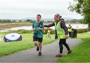 20 August 2017; Parkrun Ireland, in partnership with Vhi, expanded their range of junior events to ten with the introduction of the Oranmore Junior Parkrun on Sunday morning. Junior parkruns are 2km long and cater for 4 to 14 year olds, free of charge providing a fun and safe environment for children to enjoy exercise. To register for a parkrun near you visit www.parkrun.ie. New registrants should select their chosen event as their home location. You will then receive a personal barcode which acts as your free entry to any parkrun event worldwide. Pictured are participants with volunteer Bernie Rogers during the Oranmore Junior Parkrun, in partnership with Vhi. Rinville Park, Oranmore, Co Galway. Photo by Diarmuid Greene/Sportsfile