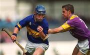 11 August 2002; Trevor Ivors of Tipperary in action against Andrew Kavanagh of Wexford during the All-Ireland Minor Hurling Championship Semi-Final match between Wexford and Tipperary at Croke Park in Dublin. Photo by Aoife Rice/Sportsfile