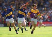 11 August 2002; Andrew Kavanagh of Wexford in action against Francis Devanney of Tipperary during the All-Ireland Minor Hurling Championship Semi-Final match between Wexford and Tipperary at Croke Park in Dublin. Photo by Brian Lawless/Sportsfile