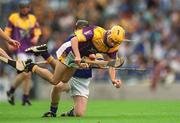 11 August 2002; Bob Jacob of Wexford in action against Derek Bourke of Tipperary during the All-Ireland Minor Hurling Championship Semi-Final match between Wexford and Tipperary at Croke Park in Dublin. Photo by Ray McManus/Sportsfile