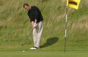 15 August 2002; Francis Howley putts from just off the 11th green with his three wood four par during day one of the North West of Ireland Open at Ballyliffin Golf Club, Glasheby Links, in Donegal. Photo by Matt Browne/Sportsfile