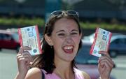 16 August 2002; Dublin supporter Kathryn Lennon, from Drumcondra, celebrates after queueing for tickets for the Bank of Ireland All-Ireland Senior Football Championship Replay match between Dublin and Donegal at Croke Park tomorrow. Photo by Damien Eagers/Sportsfile