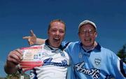 16 August 2002; Dublin supporters Liam, right, and Declan Lynch, from the Liberties, celebrate after queueing for tickets for the Bank of Ireland All-Ireland Senior Football Championship Replay match between Dublin and Donegal at Croke Park tomorrow. Photo by Damien Eagers/Sportsfile