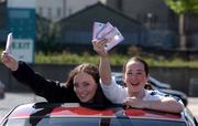 16 August 2002; Dublin supporters Therese Sweeney, right, and Sarah Moran from Castleknock, celebrate after queueing for tickets for the Bank of Ireland All-Ireland Senior Football Championship Replay match between Dublin and Donegal at Croke Park tomorrow. Photo by Damien Eagers/Sportsfile