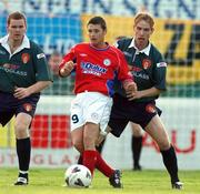 16 August 2002; Wes Hoolahan of Shelbourne in action against Colm Foley, left, and Paul Marney of St Patrick's Athletic during the eircom League Premier Division match between St Patrick's Athletic and Shelbourne at Richmond Park in Dublin. Photo by David Maher/Sportsfile