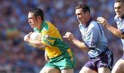 17 August 2002; Brendan Devenney of Donegal in action against Paddy Christie of Dublin during the Bank of Ireland All-Ireland Senior Football Championship Quarter-Final Replay match between Dublin and Donegal at Croke Park in Dublin. Photo by Damien Eagers/Sportsfile