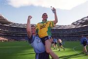 17 August 2002; Dublin's Alan Brogan is lifted by team-mate Darren Magee as they celebrate in front of Hill 16 after the Bank of Ireland All-Ireland Senior Football Championship Quarter-Final Replay match between Dublin and Donegal at Croke Park in Dublin. Photo by Damien Eagers/Sportsfile