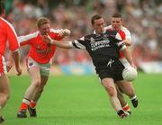 18 August 2002; Dessie Sloyan of Sligo in action against Francis Bellew, left, and John Toal of Armagh during the Bank of Ireland All-Ireland Senior Football Championship Quarter-Final Replay match between Armagh and Sligo at Páirc Tailteann in Navan, Meath. Photo by Aoife Rice/Sportsfile